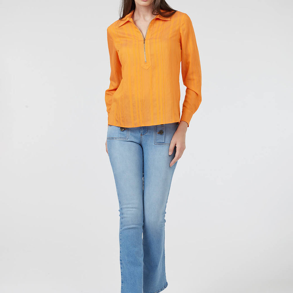 
                      
                        Blusa naranja Esenciales
                      
                    