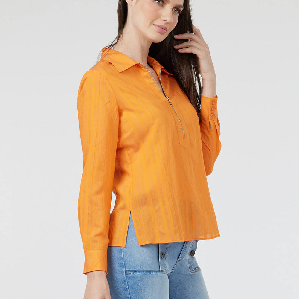 
                      
                        Blusa naranja Esenciales
                      
                    