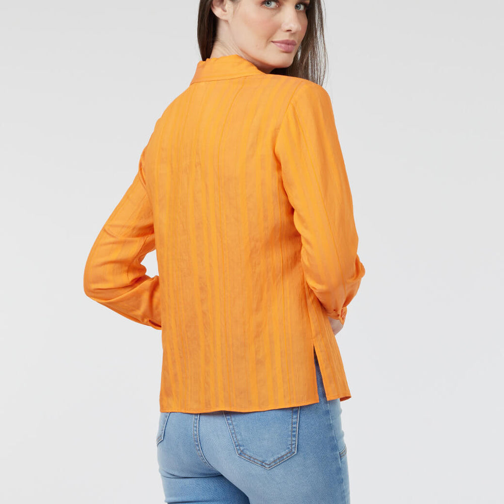 
                      
                        Blusa naranja Esenciales
                      
                    