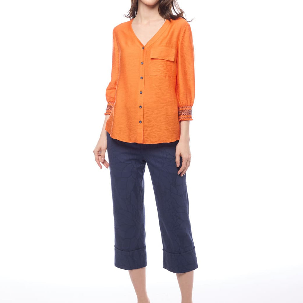 
                      
                        Blusa naranja Cedrina
                      
                    