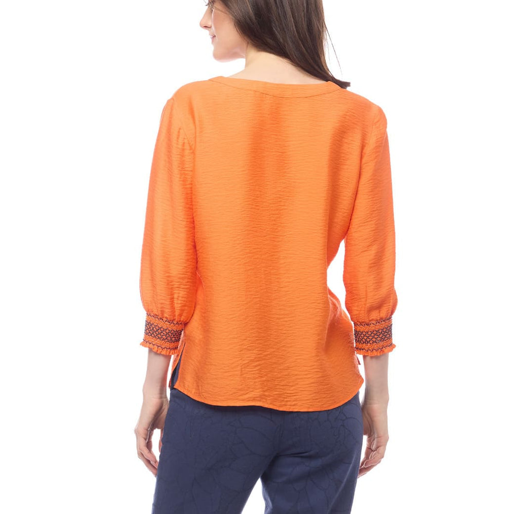 
                      
                        Blusa naranja Cedrina
                      
                    