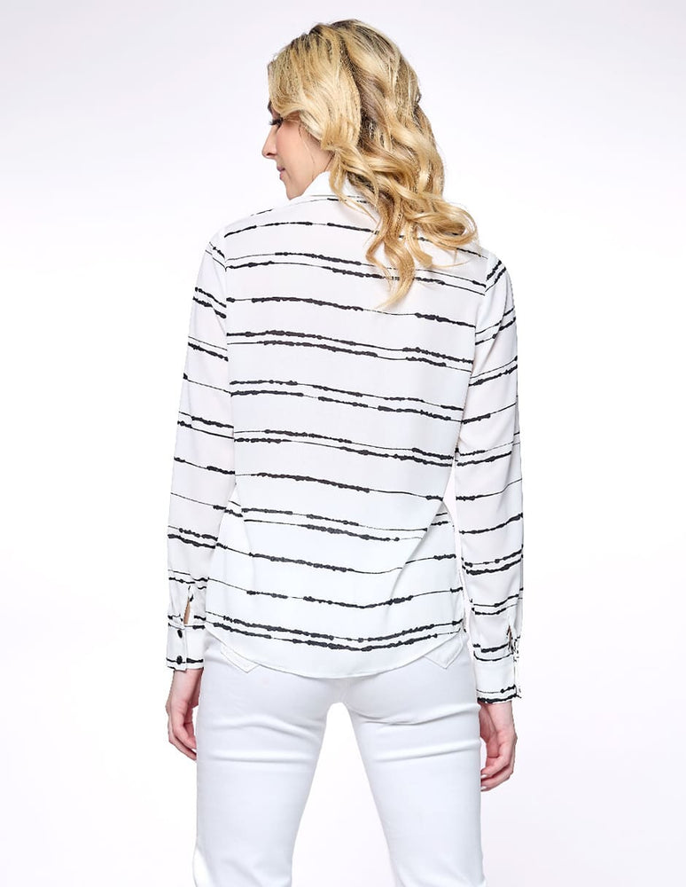 
                      
                        Blusa blanca forma en ruedo Esenciales
                      
                    