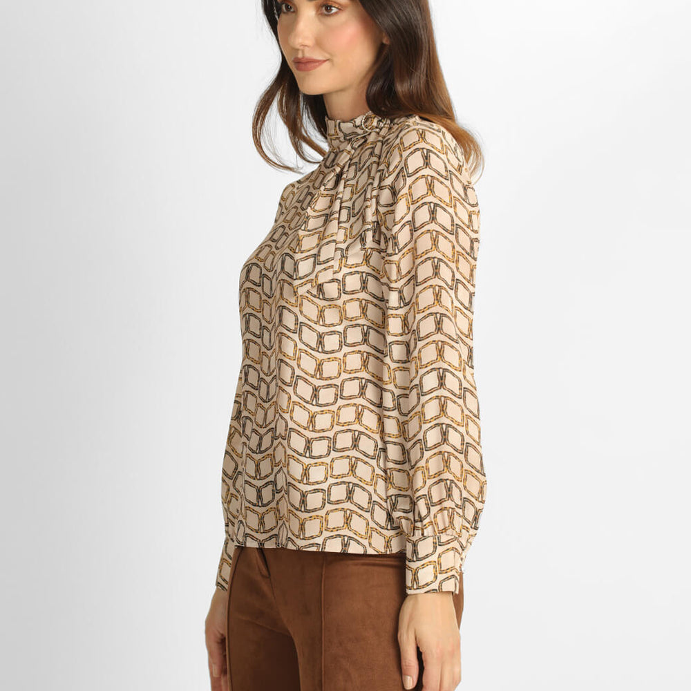 
                      
                        Blusa beige Makela
                      
                    