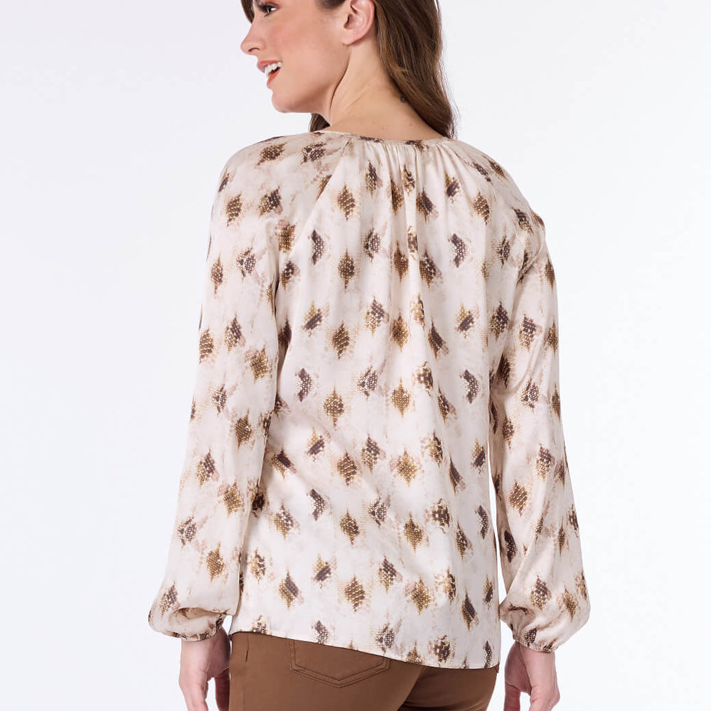 
                      
                        Blusa beige estampada Misha
                      
                    