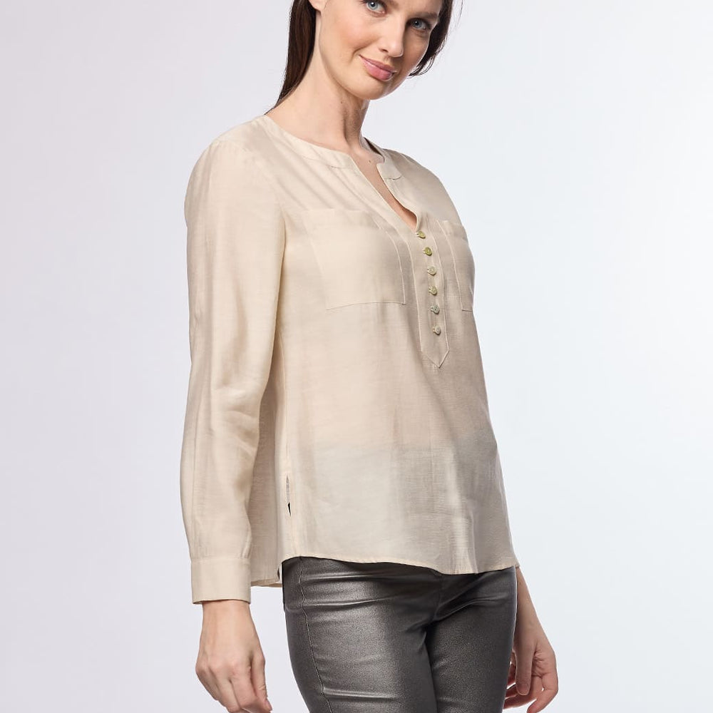 
                      
                        Blusa beige Jamila
                      
                    