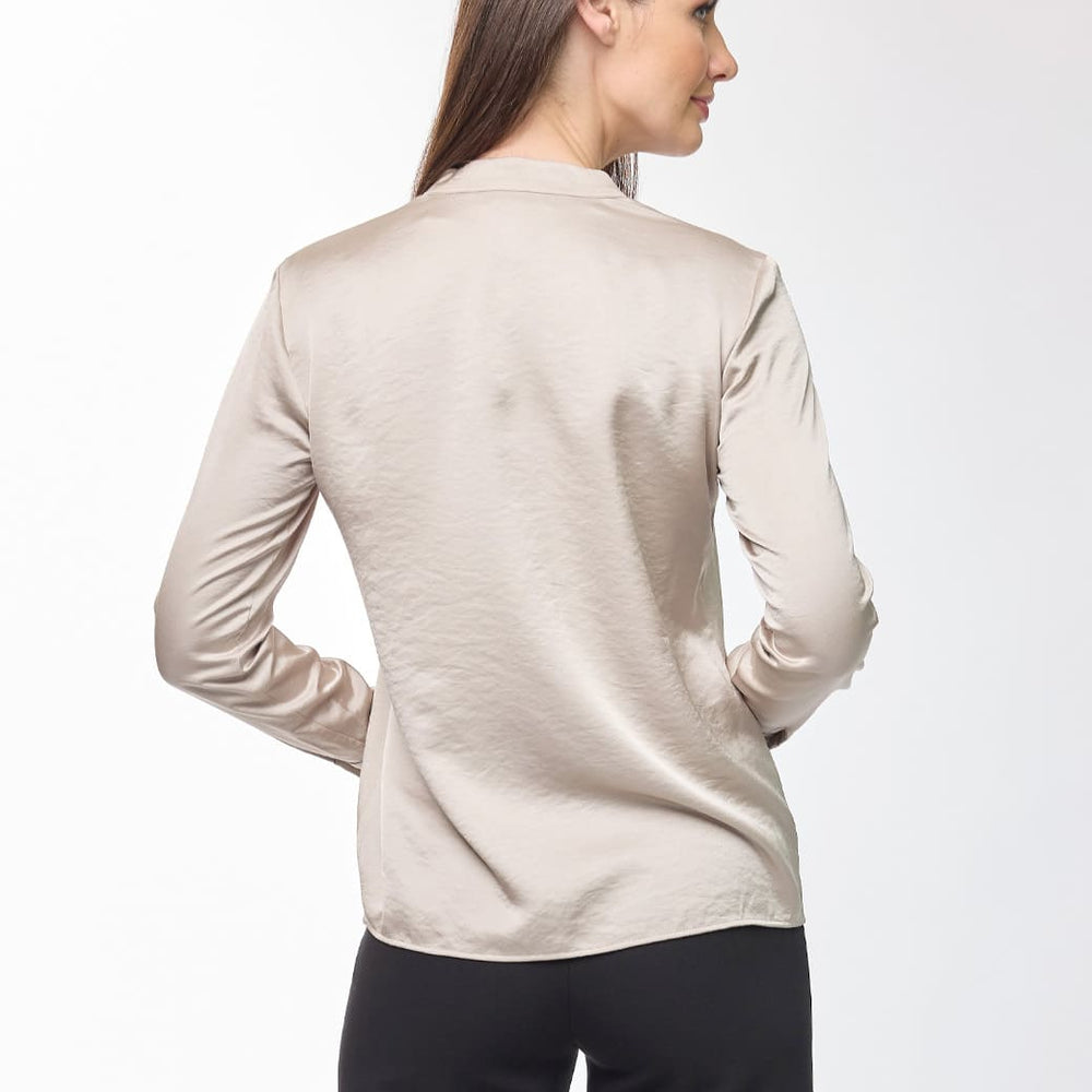 
                      
                        Blusa beige Unma
                      
                    