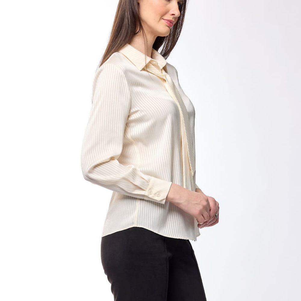 
                      
                        Blusa crema Tiziana
                      
                    