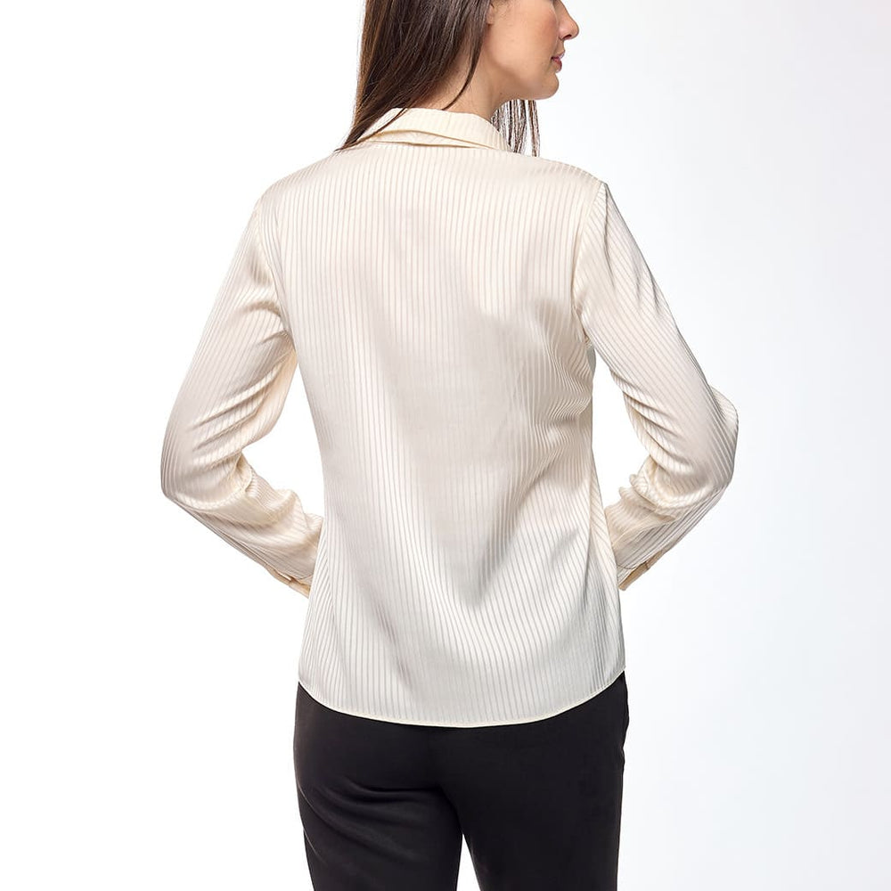 
                      
                        Blusa crema Tiziana
                      
                    