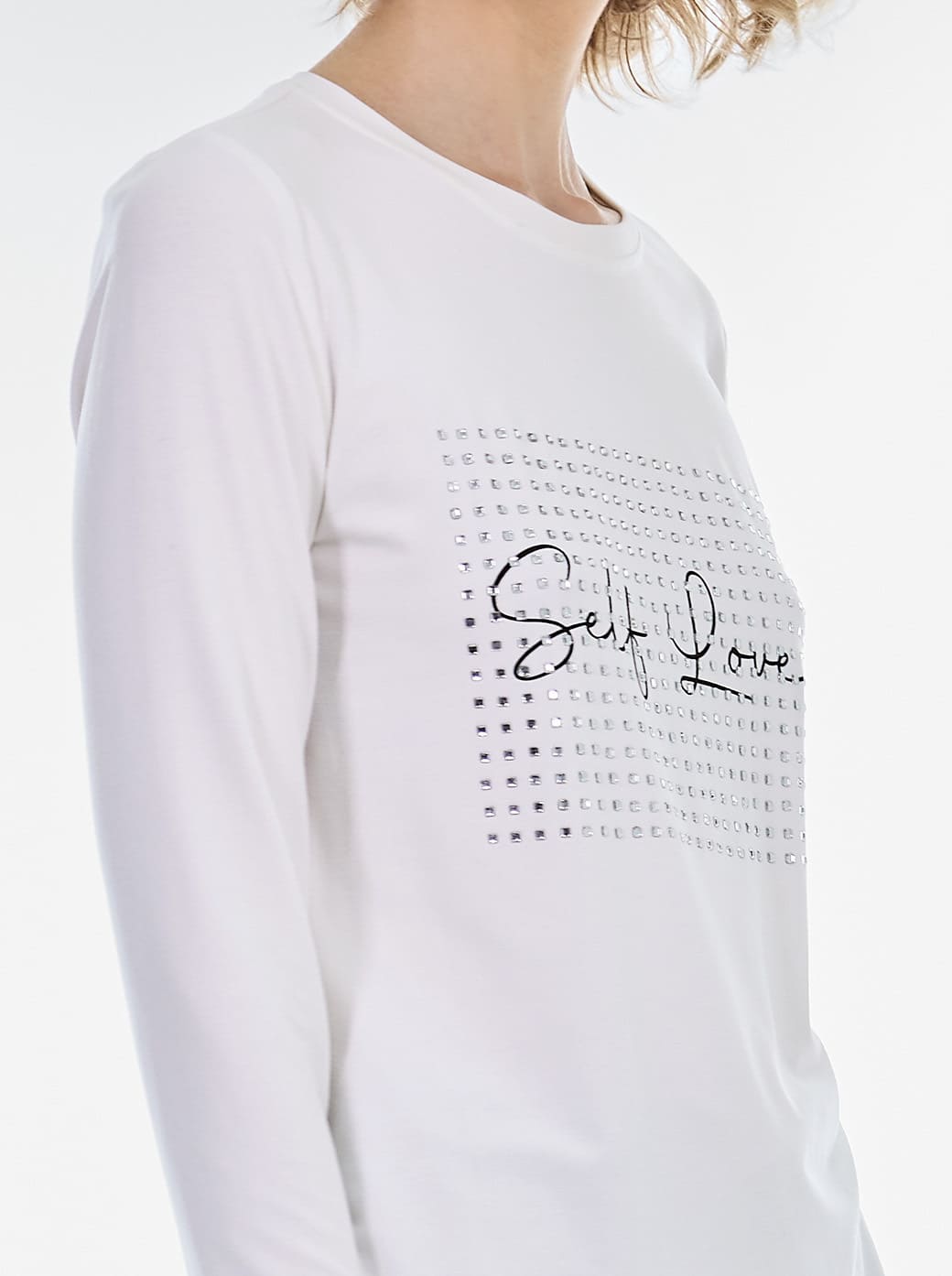 Blusa hueso letras esenciales